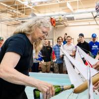 Dr. Fleischmann christens the boats before the races